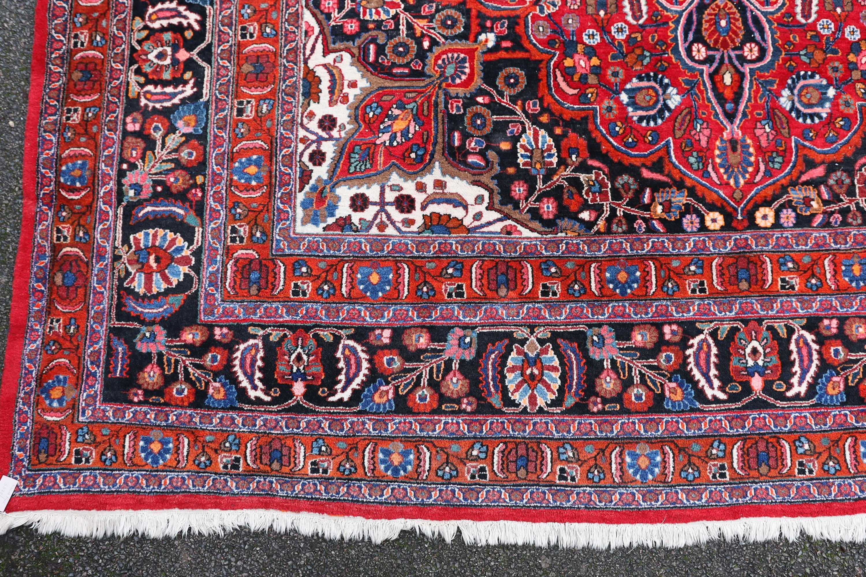 A Tabriz red ground carpet 422 x 326cm.